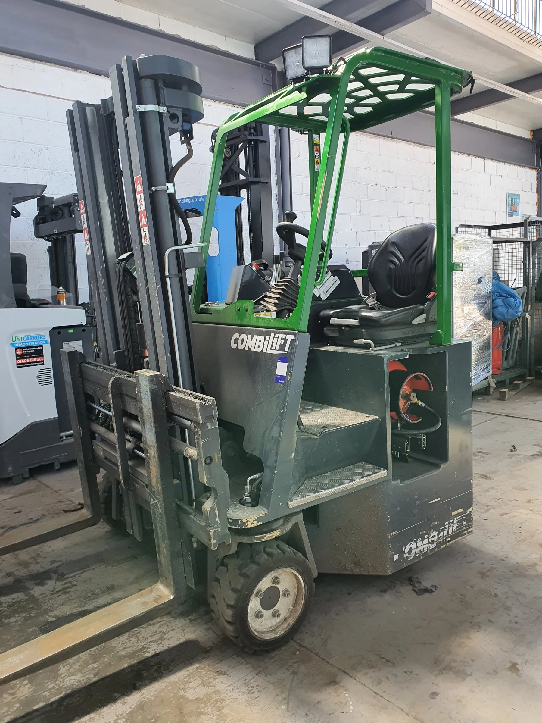Green Combilift sideloader in the workshop