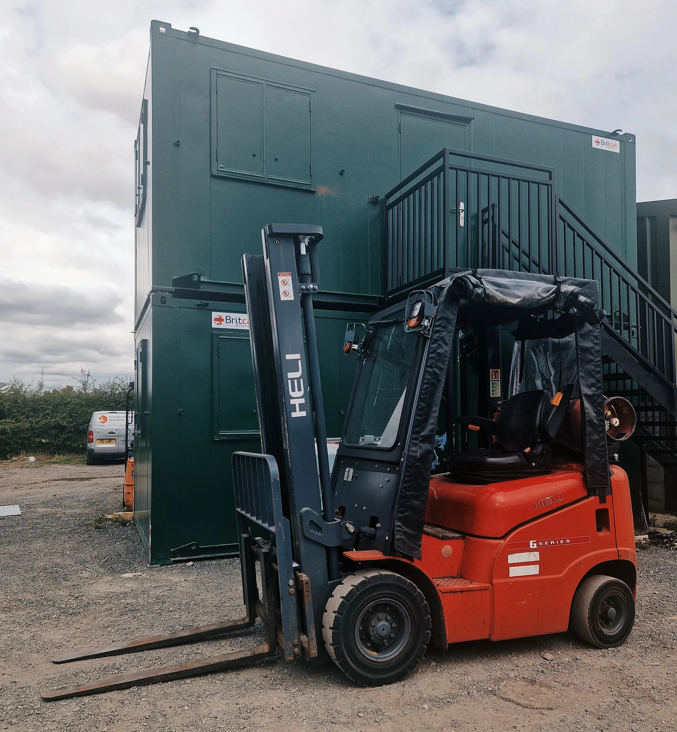 Heli 1.5 tonne LPG forklift with a semi cab in the yard